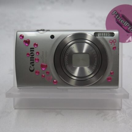 Canon Powershot ELPH 180 ♡𝘾𝙤𝙢𝙚𝙨 𝙬𝙞𝙩𝙝♡ ❥ Camera ❥ Battery ❥ SD card ❥ Charger ❥ SD card reader (if you purchase let me know if you need lightning or usb-c) ❥ Regular hand strap ❥ Beaded hand strap ❥ Case ♡ This cam has been tested extensively to make sure that everything is functional!! We can assure you that every feature has been tested and works perfectly!! ♡ 𐙚 Our shipping days are Tuesday and Thursdays so you should receive your camera 2-7 days after! #DigitalCamera #DigiCam #Camera #Canon #Powershot